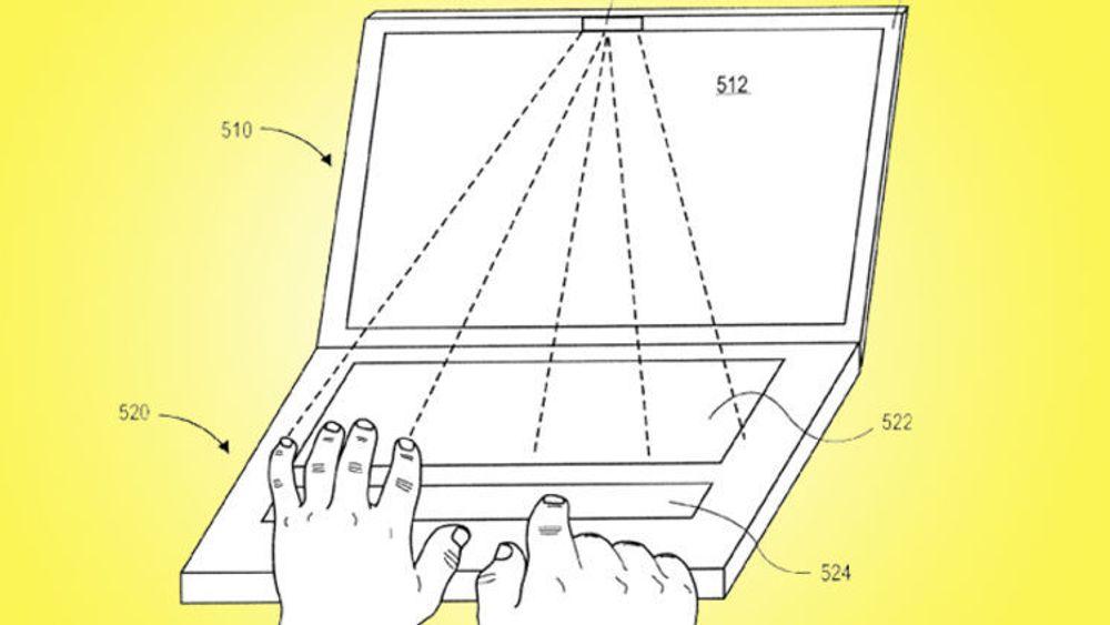 En optisk sensor i skjermens overkant merker seg hvor hendene er plassert i forhold til tastaturet, og justerer følsomheten på den langstrakte styreflaten (524) slik at høyrehånds pekefinger styrer markøren, uavheng av hvordan flaten berøres av venstre hånd.