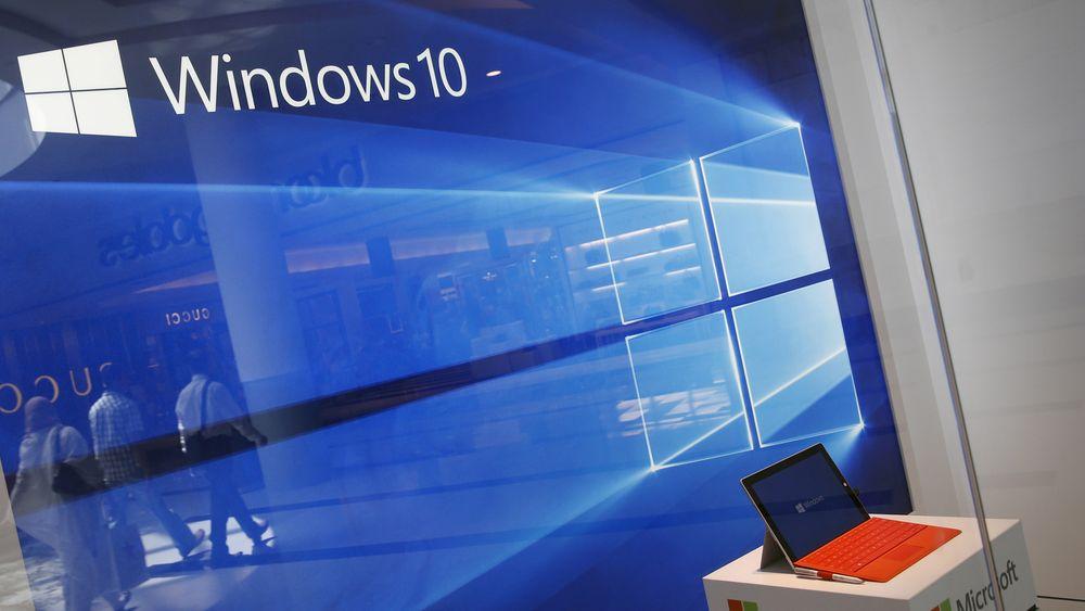 FILE PHOTO: A display for the Windows 10 operating system is seen in a store window of the Microsoft store at Roosevelt Field in Garden City, New York, U.S., July 29, 2015. REUTERS/Shannon Stapleton/File Photo