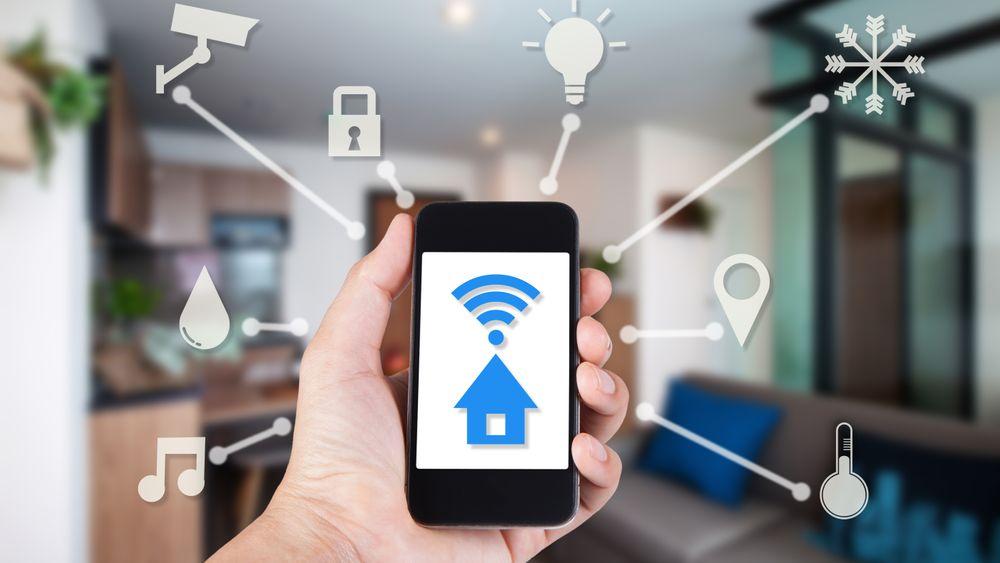 Hand using smartphone by app smart home on mobile for remote control everything in home by wifi network.