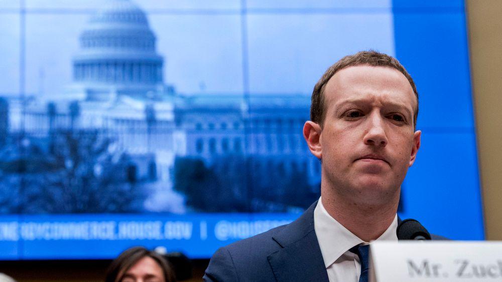 FILE - In this April 11, 2018, file photo, Facebook CEO Mark Zuckerberg pauses while testifying before a House Energy and Commerce hearing on Capitol Hill in Washington about the use of Facebook data to target American voters in the 2016 election and data privacy. Zuckerberg is calling for more outside regulation in several areas in which the social media site has run into problems over the past few years: harmful content, election integrity, privacy and data portability. (AP Photo/Andrew Harnik, File)